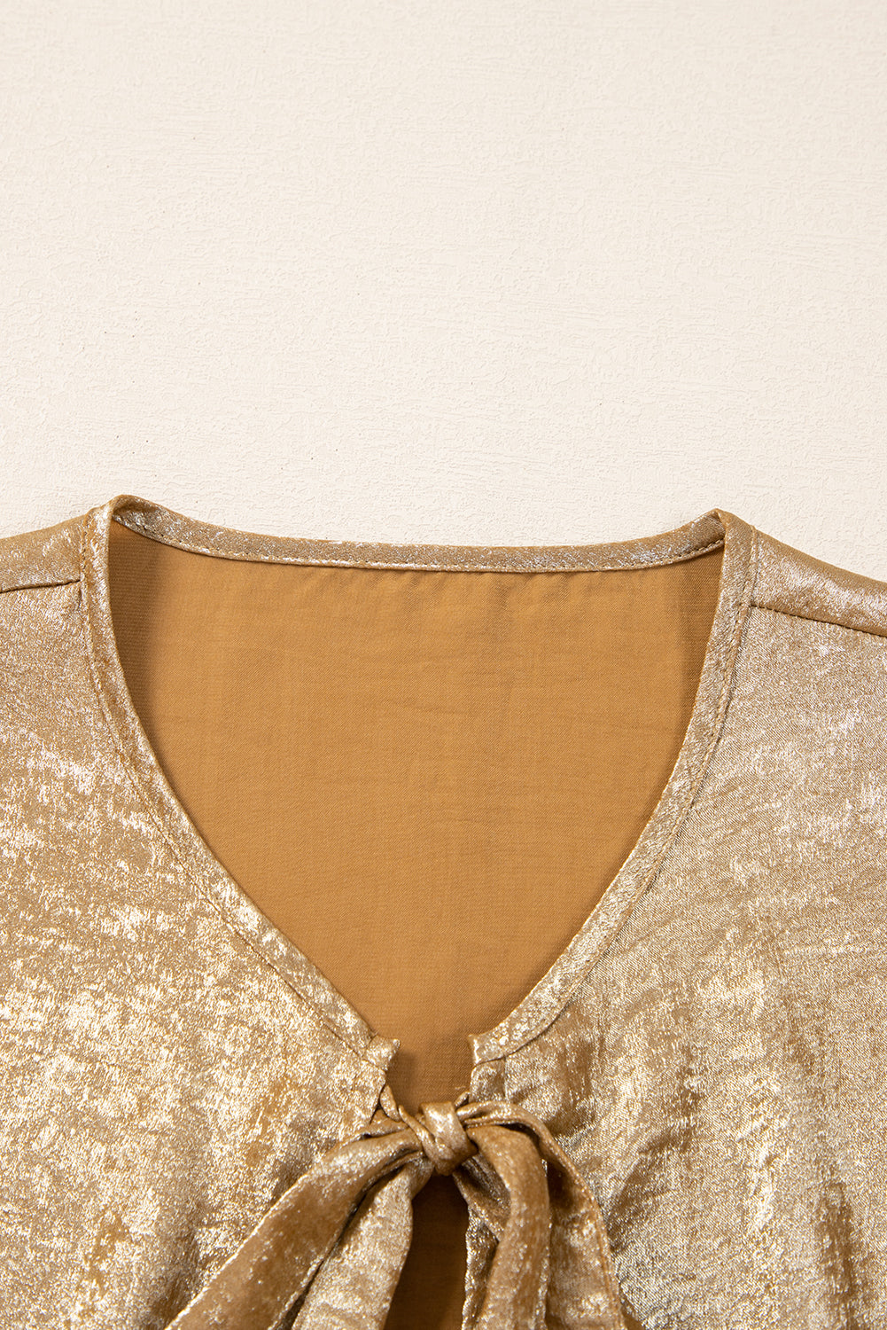 Metallic Bow Tie Front Peplum Blouse