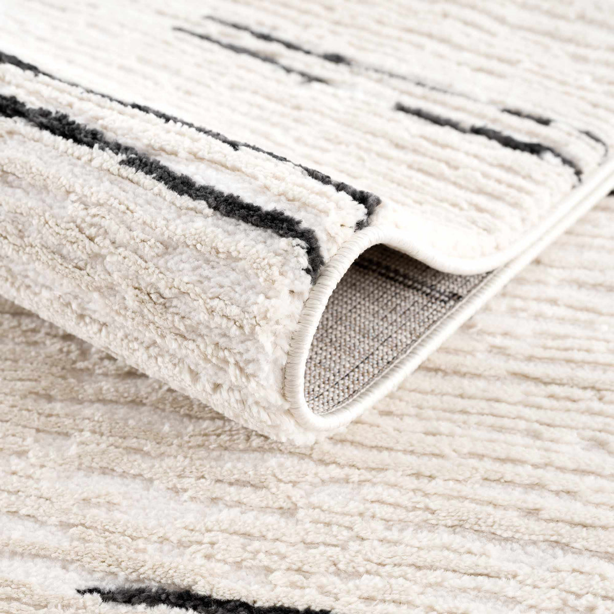 Riad Black Striped White Rug with Tassels