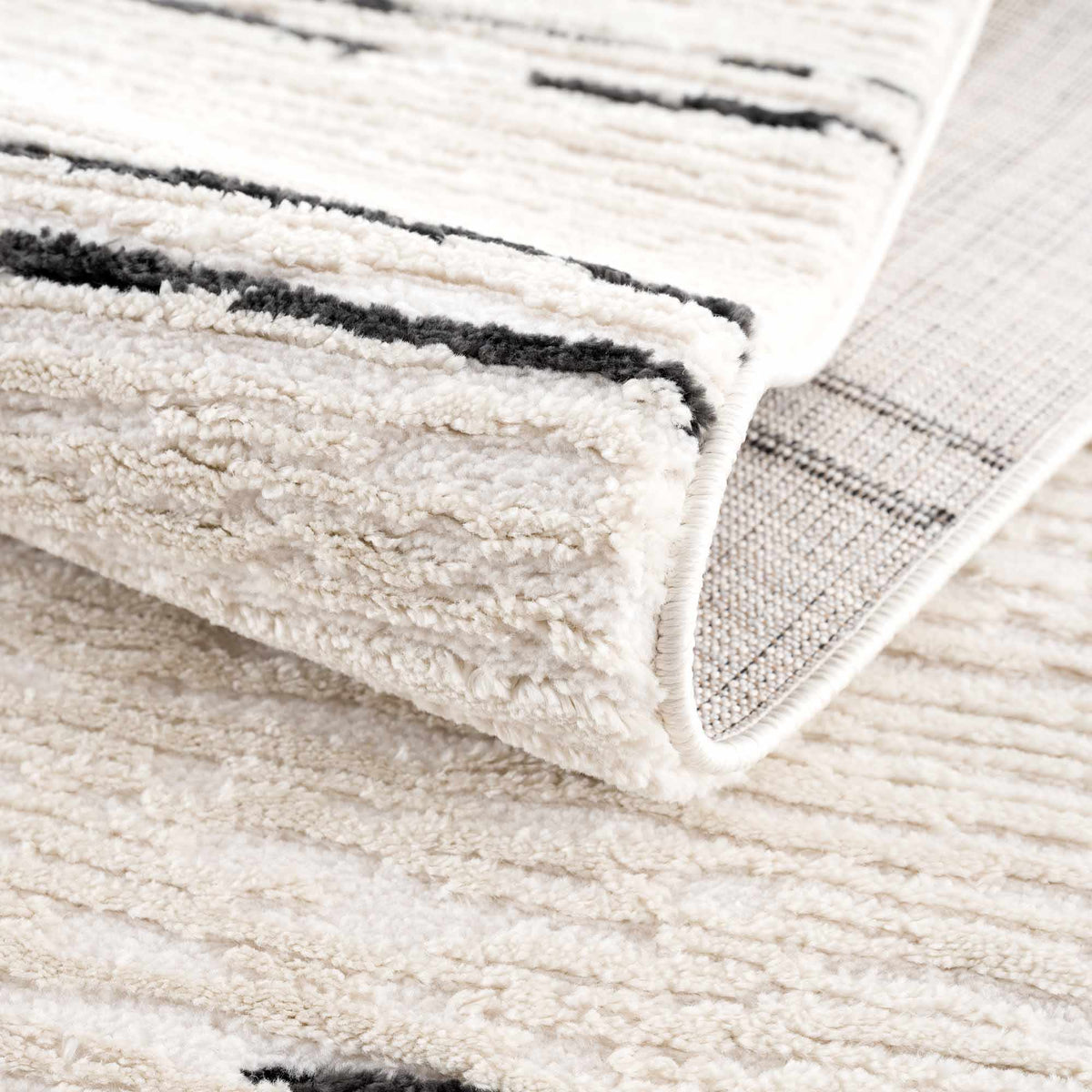Riad Black Striped White Rug with Tassels