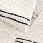Riad Black Striped White Rug with Tassels