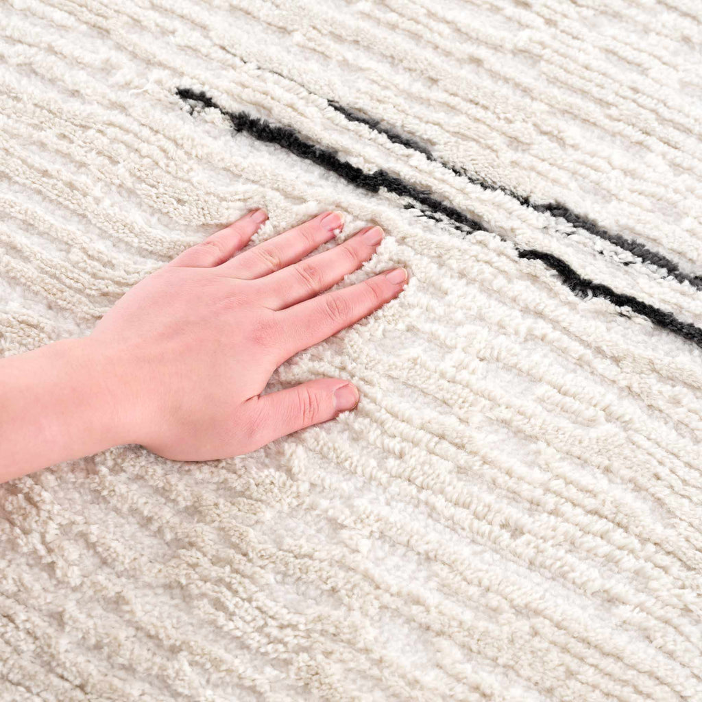 Riad Black Striped White Rug with Tassels